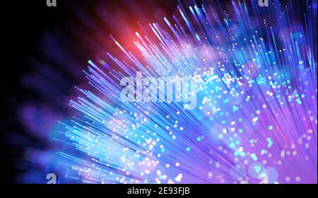optical fibres dinamic flying from deep on technology background Stock Photo