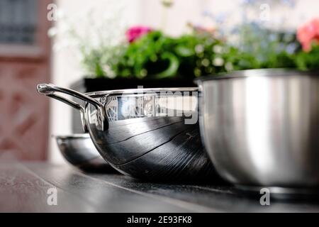 Three pans in a row at a restaurant Stock Photo