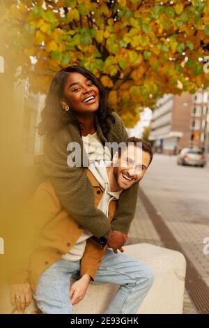 Young couple posing on street Stock Photo