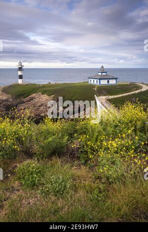 Vertical shot of an Isla Pancha lighthouse and a bridge with a ...