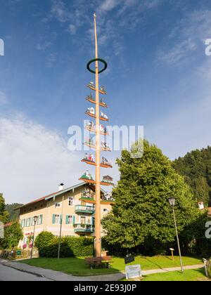 Traditional bavarian maypole (Maibaum). Village Sachrang in the Chiemgau in the bavarian alps. Europe, Germany, Bavaria Stock Photo