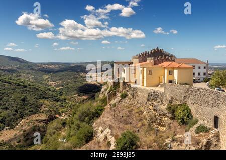 Beautiful landscape with the Church of Santiago and part of the castle of Palmela in the foreground and in the background the Serra da Arrábida. Stock Photo