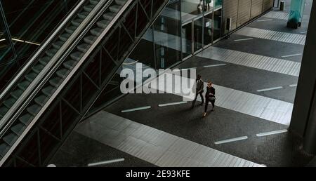 High angle view of male and female entrepreneurs on walkway Stock Photo