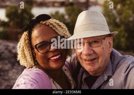 Portrait of smiling senior couple outdoors Stock Photo