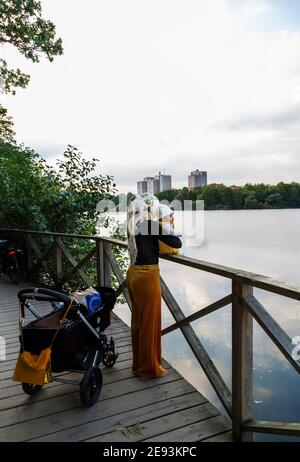 Mother with baby at lake Stock Photo