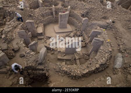 Archaeologists uncover the ancient Neolithic site of Göbekli Tepe in Turkey, revealing stone structures dating back over 11,000 years. Stock Photo