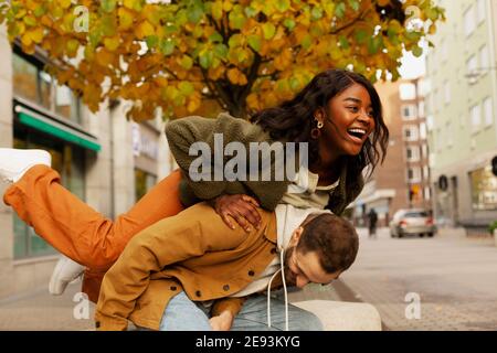 Young couple posing on street Stock Photo