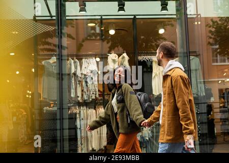 Young couple walking on shopping street Stock Photo