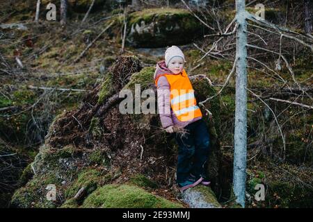Girl in forest looking at camera Stock Photo