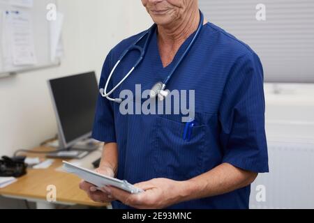 Female doctor with medical documents in office Stock Photo
