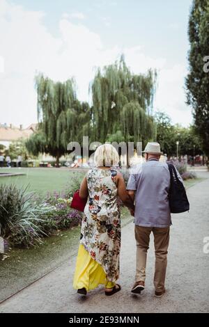 Senior couple spending leisure time in park during vacation Stock Photo