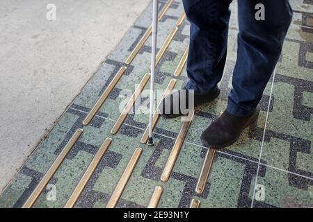 Low section of person with white cane Stock Photo