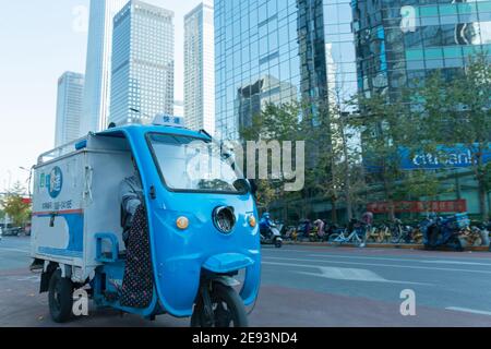 Work on the way driving tricycle Courier Stock Photo