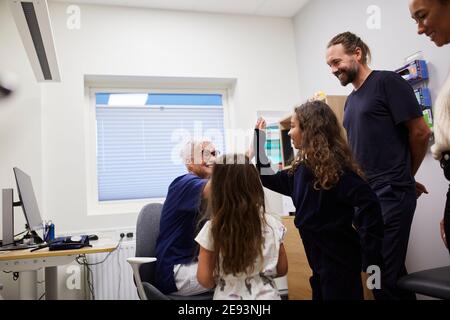 Family visiting doctor in health center Stock Photo