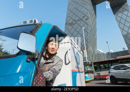 Work on the way driving tricycle Courier Stock Photo