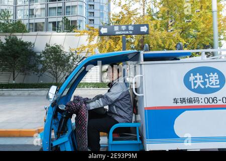 Work on the way driving tricycle Courier Stock Photo