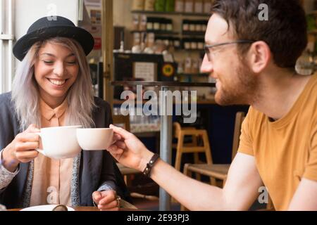 Couple having coffee in cafe Stock Photo