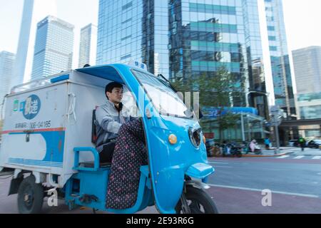 Work on the way driving tricycle Courier Stock Photo