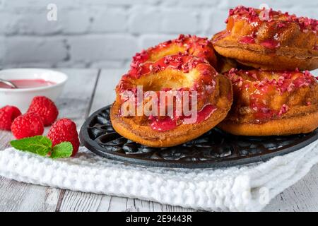 Mini vanilla pound cakes with raspberry icing Stock Photo