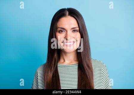 Photo of satisfied person smile look camera wear white green stripes isolated on blue color background Stock Photo
