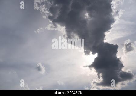 Summer blue sky with a large cloud covering the sun Stock Photo