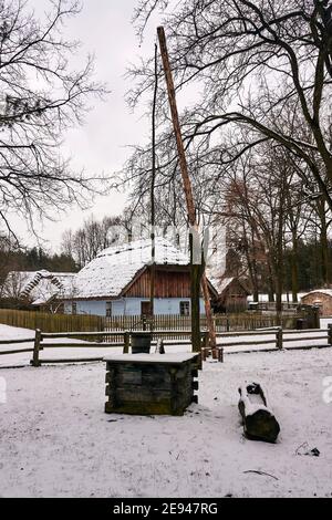 Radom, Poland -  January 15, 2021. Old wooden water crane well from Makosy Stare village in Radom Village Museum. Stock Photo