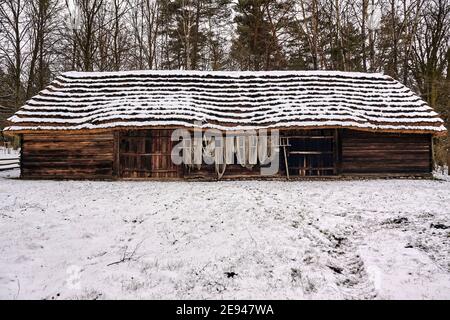 Radom, Poland -  January 15, 2021. Old wooden barn from Makosy Nowe village in Radom Village Museum. Stock Photo