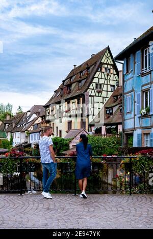 Beautiful view of colorful romantic city Colmar, France, Alsace . Europe Couple mid age men and woman on Vacation Colmar France Stock Photo