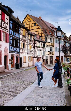 Beautiful view of colorful romantic city Colmar, France, Alsace . Europe Couple mid age men and woman on Vacation Colmar France Stock Photo