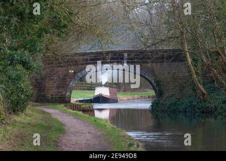 A single narrowboat moored on the Leeds Liverpool canal at Withnell Fold in Lancashire