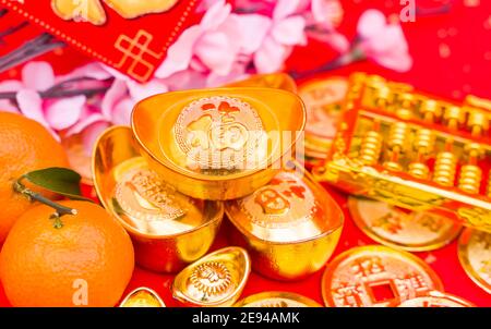 Chinese new year ornament--gold ingot and golden abacus,Chinese calligraphy on gold ingot translation:good bless for new year,Chinese characters on go Stock Photo