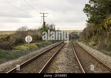 Up and down lines railway tracks with gradient, coastal line at Aberthaw, Wales, UK Stock Photo