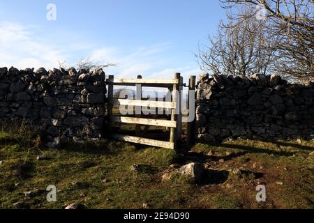 Kissing Gate for walkers in a dry stone wall on Scout Scat in Northern England's Lake District National Park. Stock Photo