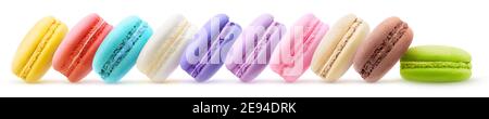 Multicolored macarons in a row isolated on white background Stock Photo
