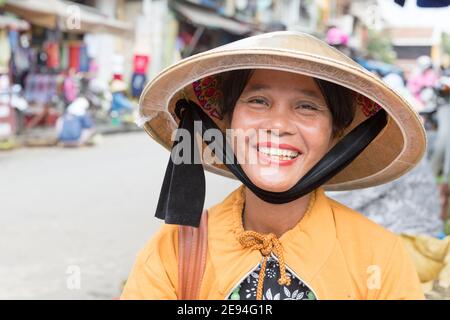 Vietnam Hoi An Portrait of woman selling fruit in the street. Stock Photo