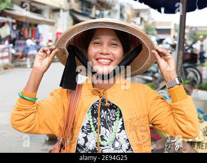 Vietnam Hoi An Portrait of woman selling fruit in the street. Stock Photo