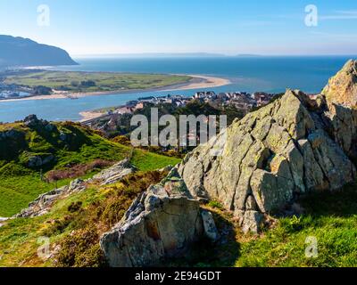 View looking down over Deganwy and the mouth of the River Conwy in Conwy North Wales from the ruins of Deganwy Castle with rocks in foreground. Stock Photo
