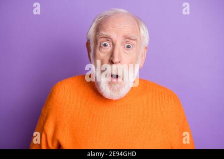 Photo of shocked aged person open mouth look camera wear sweater isolated on violet color background Stock Photo