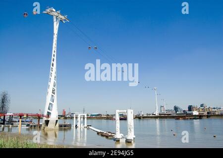 View of the new cable car public transport link between Greenwich and Docklands in the East of London.  View from public footpath. Stock Photo