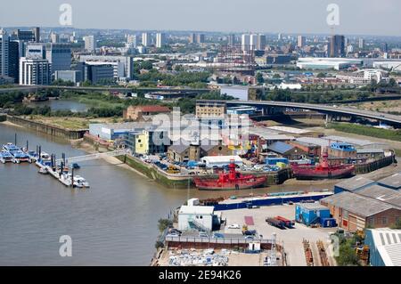 View from above of the River Thames and River Lea and the island with Trinity Buoy Wharf in Newham, East London. East India Dock basin behind View fro