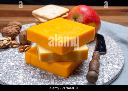 Cheese collection, orange and yellow smoked British cheese from England close up Stock Photo