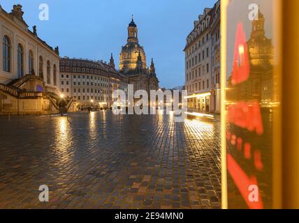 Dresden, Germany. 02nd Feb, 2021. The Frauenkirche on the Neumarkt is reflected in the evening in a sign of a hotel. Credit: Robert Michael/dpa-Zentralbild/ZB/dpa/Alamy Live News Stock Photo