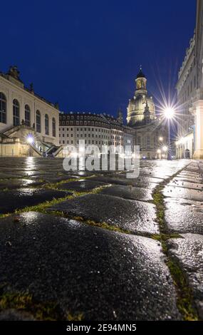 Dresden, Germany. 02nd Feb, 2021. The lights on Neumarkt reflect on the cobblestones in the evening in front of the Frauenkirche (r) and the Museum of Transport (l). Credit: Robert Michael/dpa-Zentralbild/ZB/dpa/Alamy Live News Stock Photo