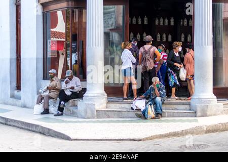 Cuban people lining-up to buy medications in the Campa Pharmacy. They are wearing face masks as it is the time of the Covid-19 Stock Photo