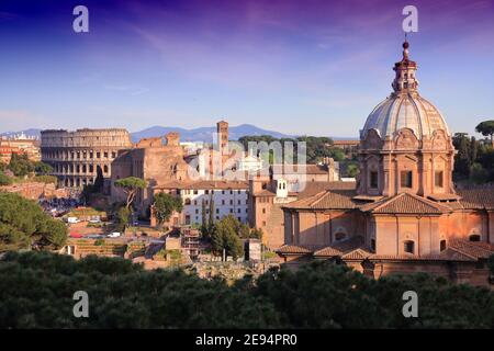 Rome city, Italy. Cityscape with Colosseum in sunset light. Stock Photo