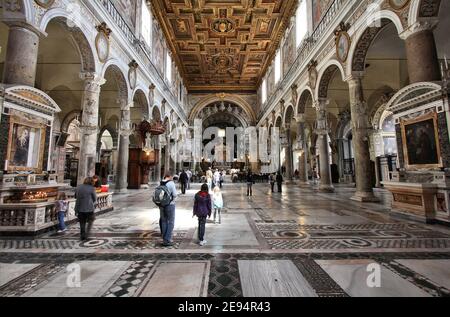ROME, ITALY - APRIL 8, 2012: Tourists visit Basilica Santa Maria in Aracoeli in Rome. The famous romanesque church dates back to 12th century.