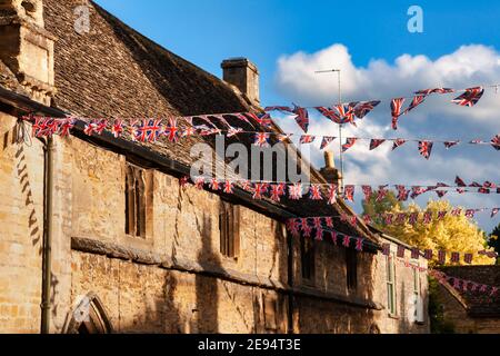 Union Jack flag bunting hanging in a street, a festive decorations in Southwest England, UK Stock Photo