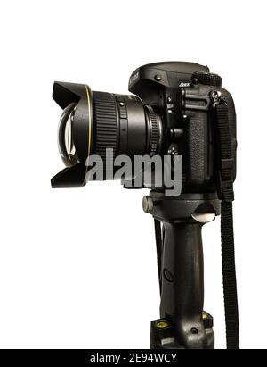 photo camera Nikon D800 + Nikkor lens 14mm standing on heavy tripod against the 255 white Stock Photo