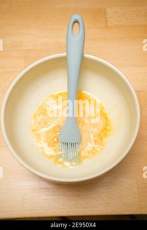 egg wash with brush Stock Photo - Alamy