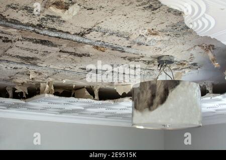 Broken false ceiling at home Stock Photo - Alamy